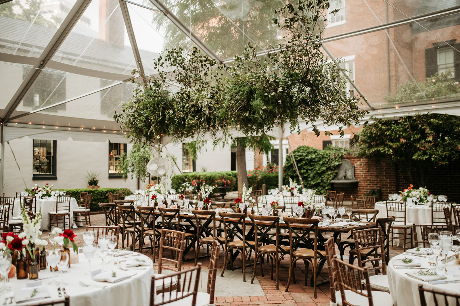 Tent Wedding Reception with Greenery and Red Flowers at Decatur House in Washington, DC